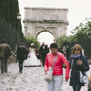 bride and groom walking down the via sacra